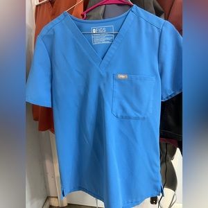 Figs one pocket capri blue scrub top. Size small.